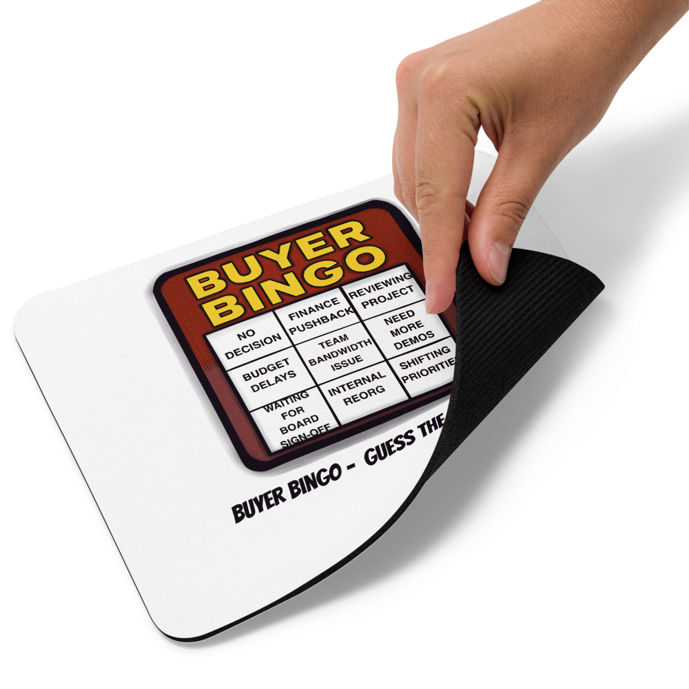 funny “Buyer Bingo” mouse pad hand lifting to show rubber bottom