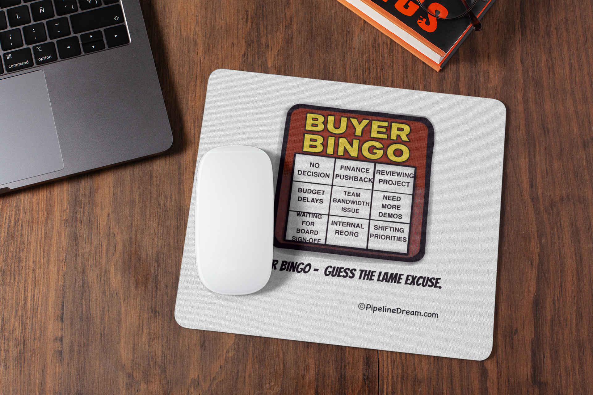 funny sales mouse pad with “Buyer Bingo” cartoon on office desk