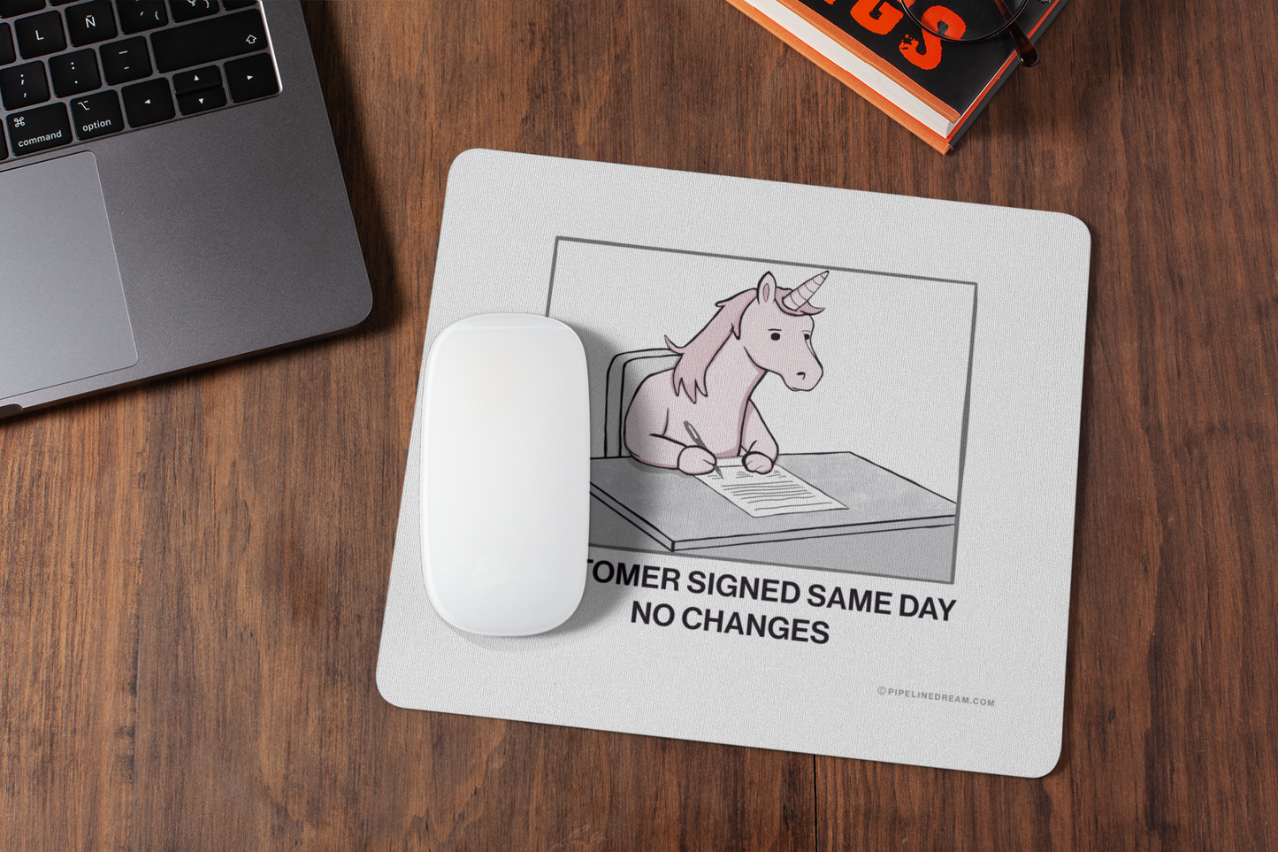 Sales humor mouse pad displayed on a modern office desk workspace for SDRs, AEs, and sales managers — Pipeline Dream