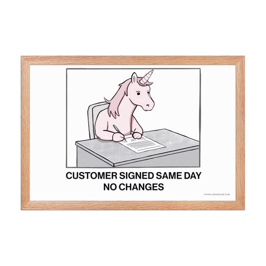 Sales humor poster about buyer inertia and rare contract approvals, shown in a red oak wood frame – Pipeline Dream