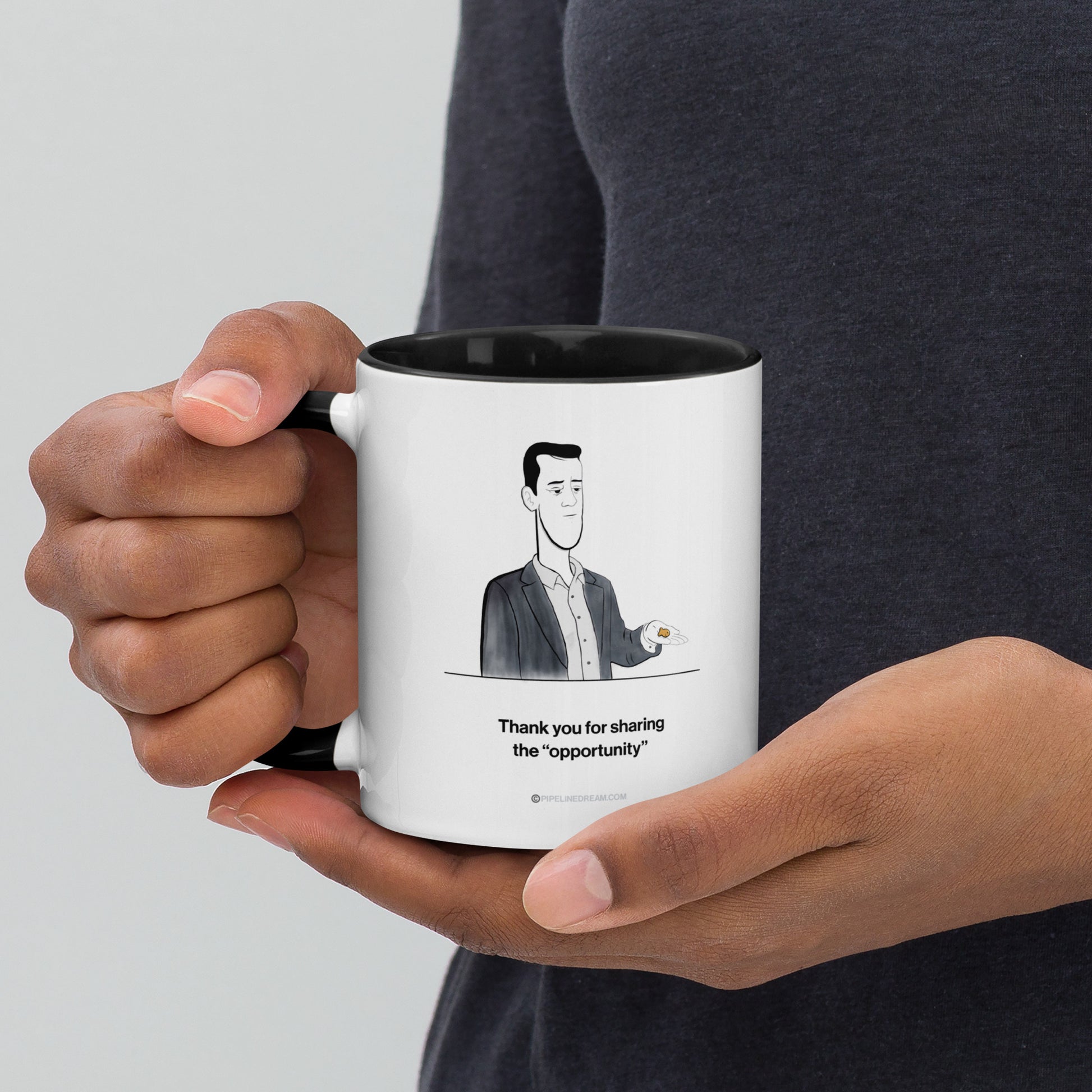 Sales humor mug held in hand featuring the Golden Lead cartoon